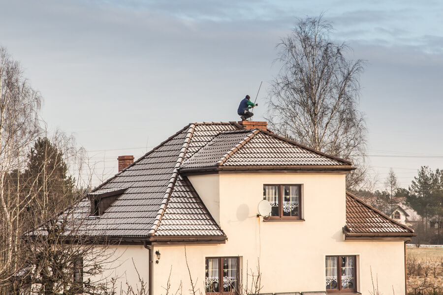 Chimney Sweep Cleans The Chimney